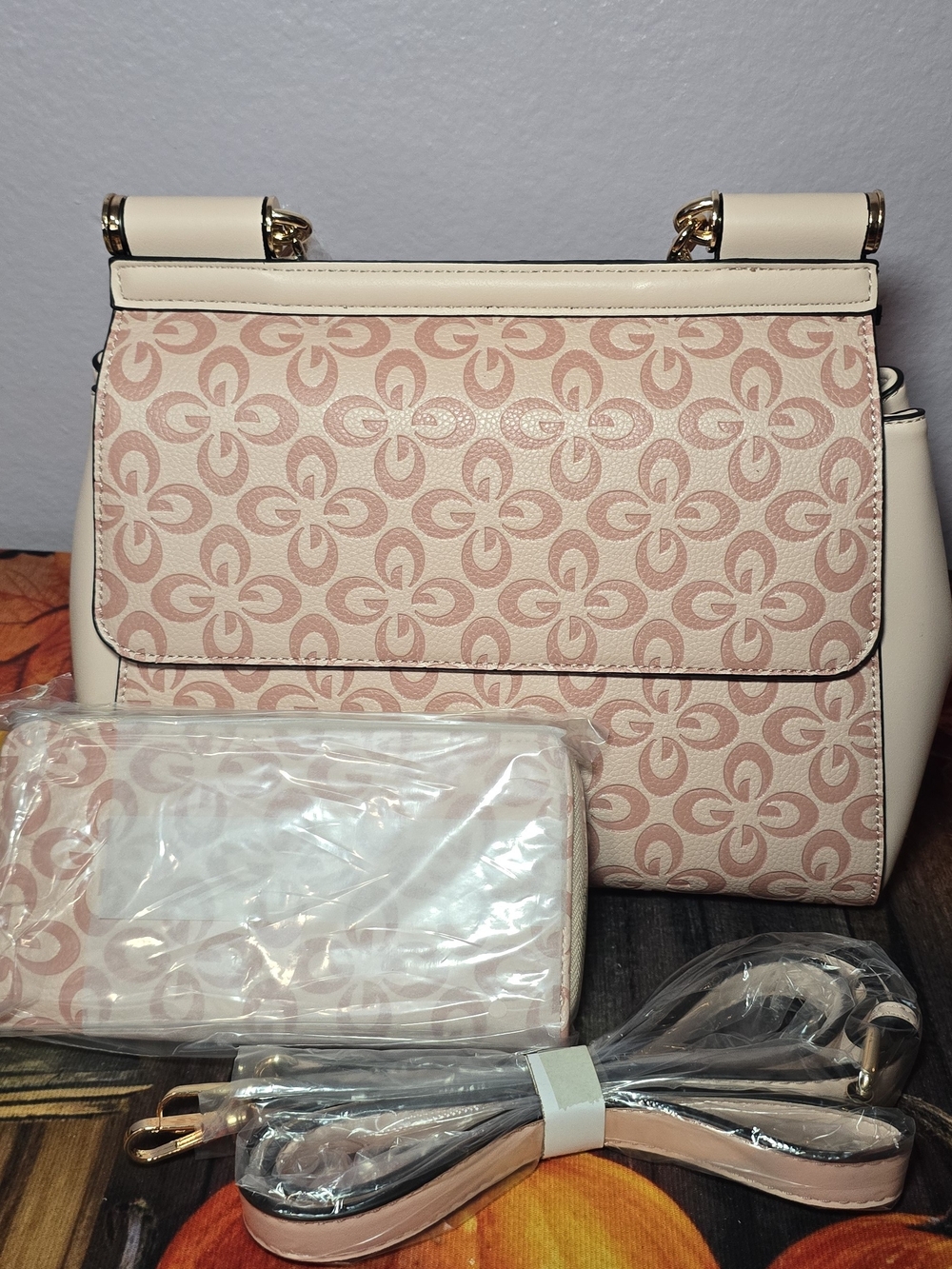 Elegant Pink Patterned Top-Handle Bag with Matching Wallet